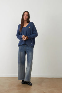 Orfeo Lam V-neck sweater with Lam flower jewel brooch