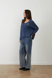 Orfeo Lam V-neck sweater with Lam flower jewel brooch